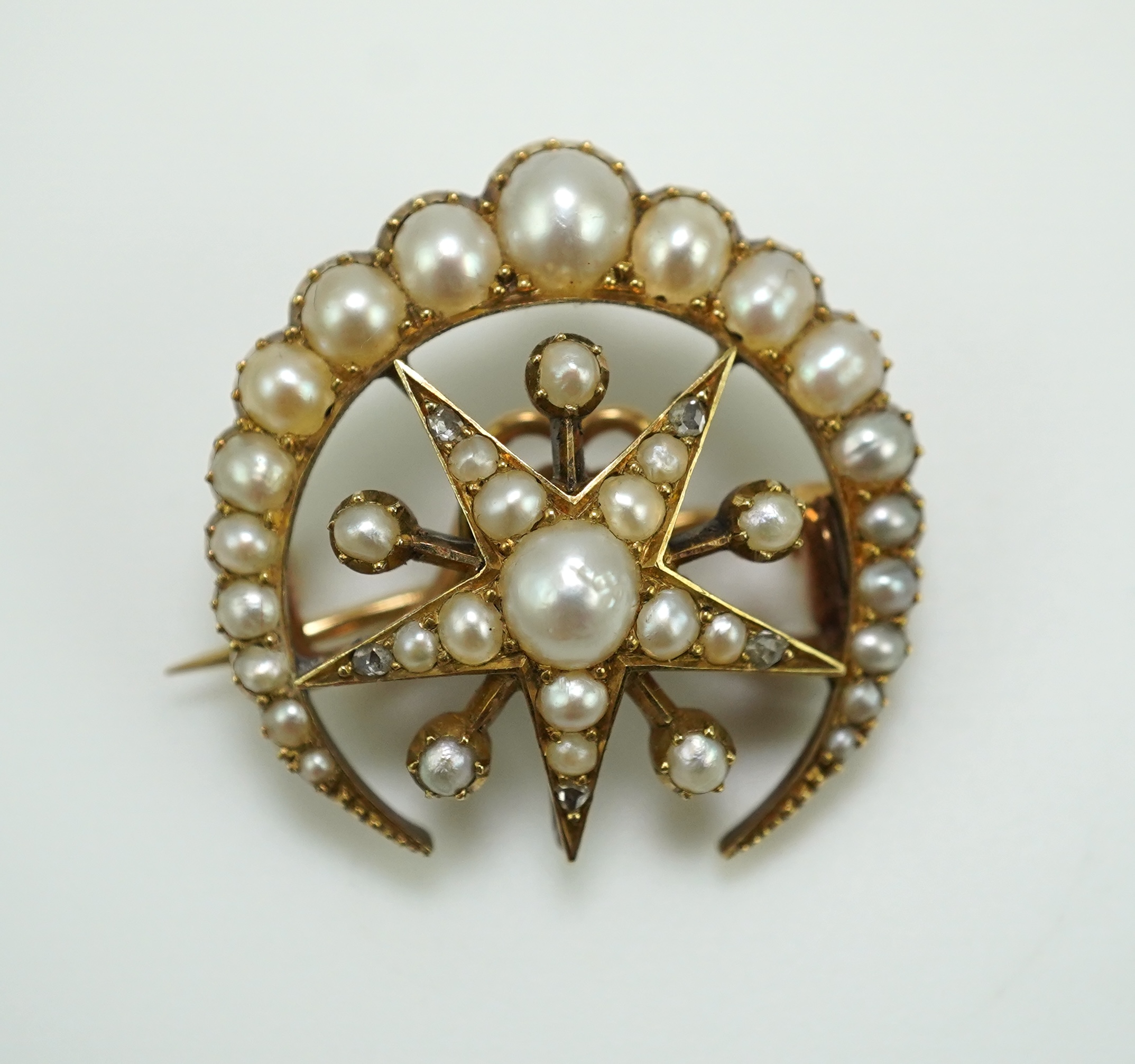 An Edwardian half pearl and diamond brooch, early 20th century